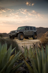 https://serenity-foxfactory.asset.akeneo.cloud/fox_asset_family/media/MRW_703_Bronze_5lug_Jeep_01.