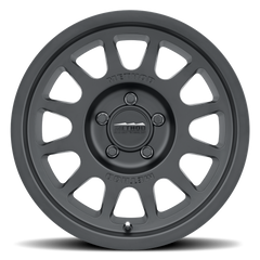 https://serenity-foxfactory.asset.akeneo.cloud/fox_asset_family/media/MRW_703_Matte_Black_5lug_Studio_Front.png