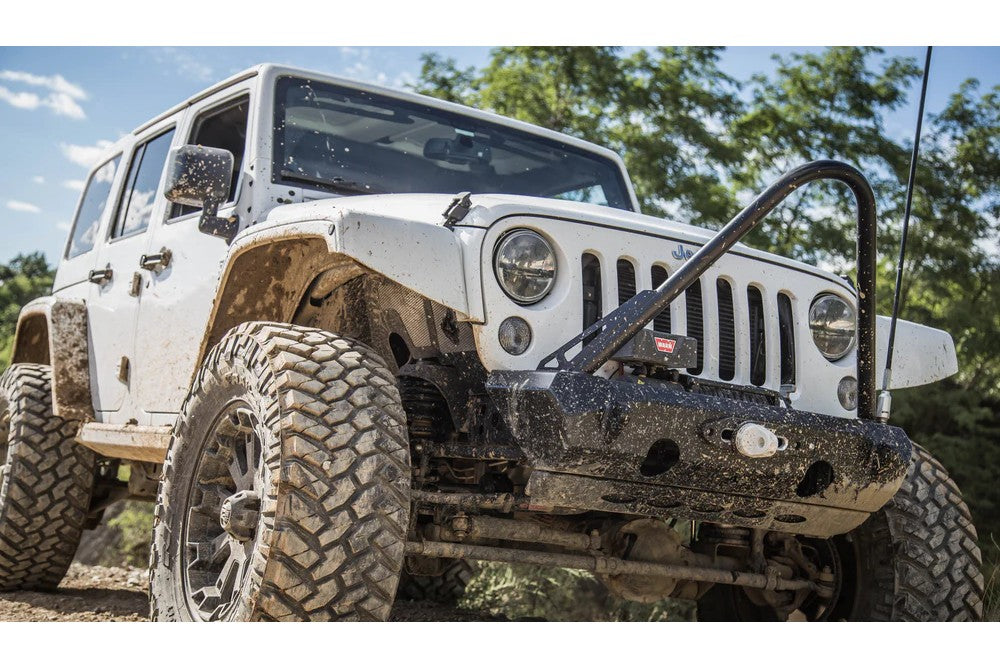 https://serenity-foxfactory.asset.akeneo.cloud/fox_asset_family/media/cwl_jk10101_lifestyle_02_jeep_jk_pyro_stubby_bumper.jpg